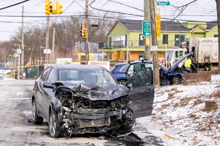 Abstract, flat graphic with comic borders. A motorcycle and a Hyundai are depicted in a head-on collision on a road. An abstract form suggests the motorcyclist was thrown, and another implies the Hyundai driver remained at the scene. Somber, respectf